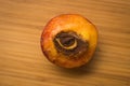 Half of peach with stone in shape of an eye Royalty Free Stock Photo