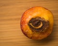 Half of peach with stone in shape of an eye Royalty Free Stock Photo