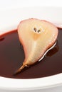 Half of the pear poached in red wine Royalty Free Stock Photo