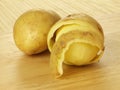 Half peeled potatoes Royalty Free Stock Photo