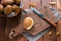 Half-peeled potatoes on a cutting board Royalty Free Stock Photo