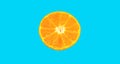 Half piece slice of fresh orange isolated on blue background.