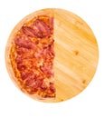 Half of pizza bacon, on bamboo bottom, isolate on white