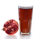 Half of pomegranate fruit and glass with juice Royalty Free Stock Photo