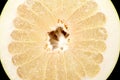 Half of pomelo, chinese grapefruit on black Royalty Free Stock Photo