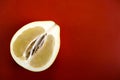 Half a pomelo on a red background