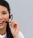 Half portrait of an asian secretary with earpiece Royalty Free Stock Photo