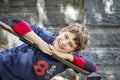 Half portrait of happy eight year old birthday boy wearing number 8 shirt leaning on stair rail Royalty Free Stock Photo