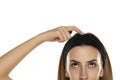 Half portrait of a young woman with headband scratching her head Royalty Free Stock Photo