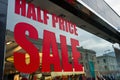 Half price sale sign in a shop window. Royalty Free Stock Photo