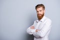 Half-profile portrait of serious confident bearded man keeping Royalty Free Stock Photo