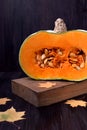 Half of a pumpkin with orange flesh Royalty Free Stock Photo