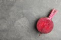 Half of raw beet on grey table, top view. Space for text Royalty Free Stock Photo