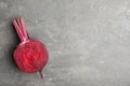 Half of raw beet on grey table, top view. Space for text Royalty Free Stock Photo