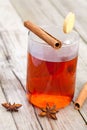 Half red tea with cinnamon sticks Royalty Free Stock Photo