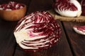 Half of ripe radicchio on wooden table Royalty Free Stock Photo