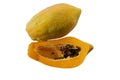 Half of ripe with seeds and whole papaya fruit