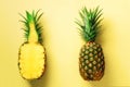 Half slice of fresh pineapple and whole fruit on yellow background. Top View. Copy Space. Bright pineapples pattern for Royalty Free Stock Photo