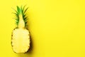 Half of sliced pineapple on yellow background. Top View. Copy Space. Bright pattern for minimal style. Pop art design Royalty Free Stock Photo