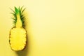 Half of sliced pineapple on yellow background. Top View. Copy Space. Bright pattern for minimal style. Pop art design Royalty Free Stock Photo