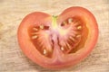 Half-sliced tomato with seeds image