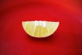 A half sour fresh lime on the red plate Royalty Free Stock Photo