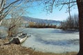 Half sunk boat in frozen lake