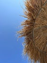 Half sunshade, half blue sky. Summer background. View while sunbathing on the beach.