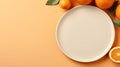 Half of a sweet orange and four whole oranges are placed on an orange-colored table, around a white ceramic plate. Mockup.