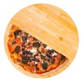 A half of tasty pizza with cherry tomatoes, spinach, mozzarella, feta, kalamata olive and mushrooms on a wooden platter isolated Royalty Free Stock Photo