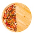 A half of tasty pizza with mushrooms, corn, cherry tomatos, courgettes and bell peppers on a wooden platter isolated on white Royalty Free Stock Photo