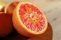 Half of tasty Sicilian orange on table, closeup