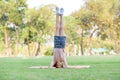 Half Thai-European girls exercising in gymnastics as part of their learning outside of school in the park