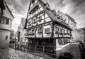 Half-timbered Crooked House or Hotel Schiefes Haus in black and white, Ulm, Germany. It is tourist attraction of Ulm