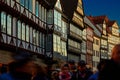 Half-timbered facades over a crowd of people in the evening sun in the old town of Hannover