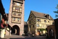 half-timbered house and belfry (dolder) in a village (riquewihr) in alsace (france) Royalty Free Stock Photo