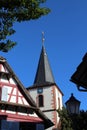 Half-timbered house and church in Kehl-Kork. Royalty Free Stock Photo
