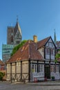 A half-timbered house and the Ribe cathedral in the background Royalty Free Stock Photo