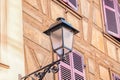 Half timbered house and street lantern. Details. Colmar town, France