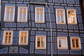 Half-timbered house with yellow windows Royalty Free Stock Photo