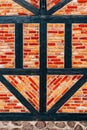 Half-timbered old house wall, brick wall pattern with timber framework. Detail from town of Halmstad in Sweden Royalty Free Stock Photo