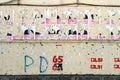 Half-torn election posters and graffiti from the June 2013 general election on a wall in Berat, Albania