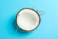 Half tropical coconut on color background