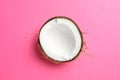 Half tropical coconut on color background