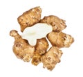 Half of tuber on pile of ripe jerusalem artichokes Royalty Free Stock Photo