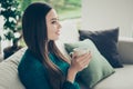 Half turned close-up photo portrait of positive satisfied stylish modern pretty delightful shinny in green sweater