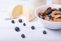 Half view of a Close view of a cereals with blueberries with moazzarella and glass of milk on a background. with central focus and