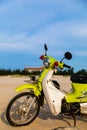 A half of vintage green motorbike park on the beach