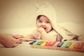 Half year baby girl playing with xylophone toy on blanket Royalty Free Stock Photo