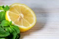 Half a lemon and fresh mint close-up Royalty Free Stock Photo